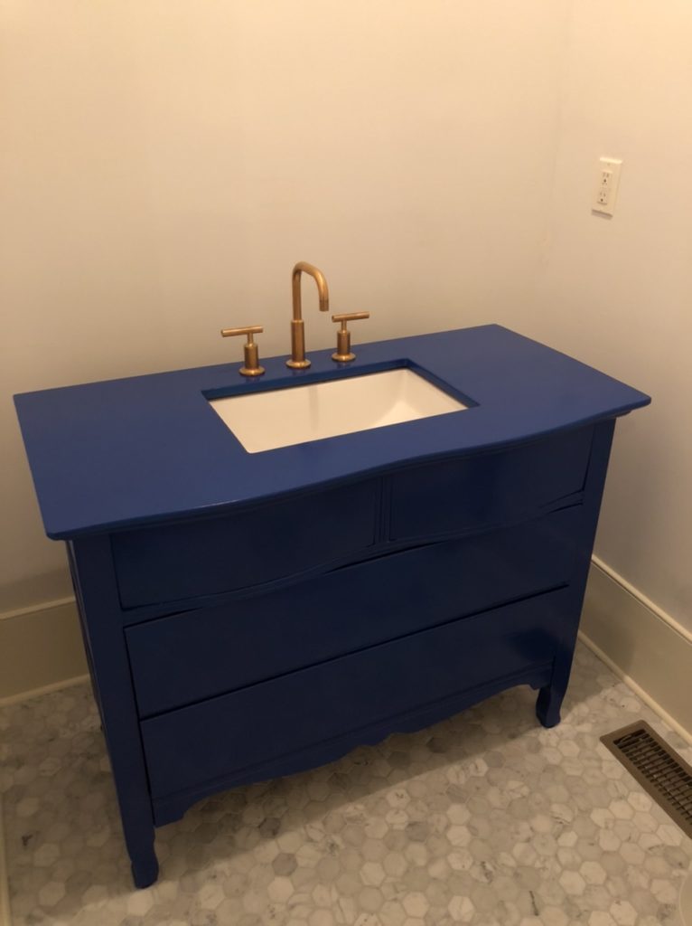 Transformed a family heirloom set of drawers into a powder bath vanity. Oh and I did the tile too.
